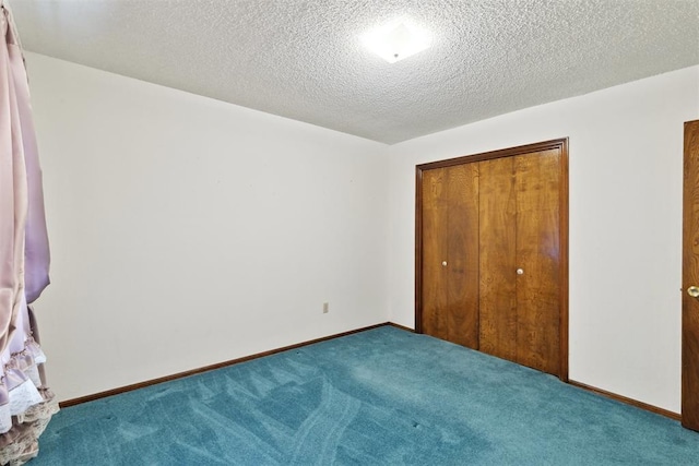 929 NE 5th St, Moore, OK 73160 - unfurnished bedroom with carpet, a closet, and a textured ceiling