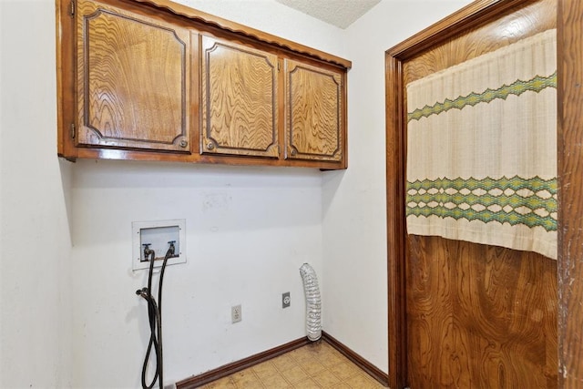 929 NE 5th St, Moore, OK 73160 - laundry area featuring washer hookup and cabinet space