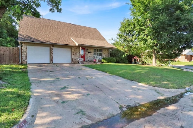 1001 NW 2nd St, Moore, OK 73160 - view of front facade featuring an attached garage, concrete driveway, and brick siding