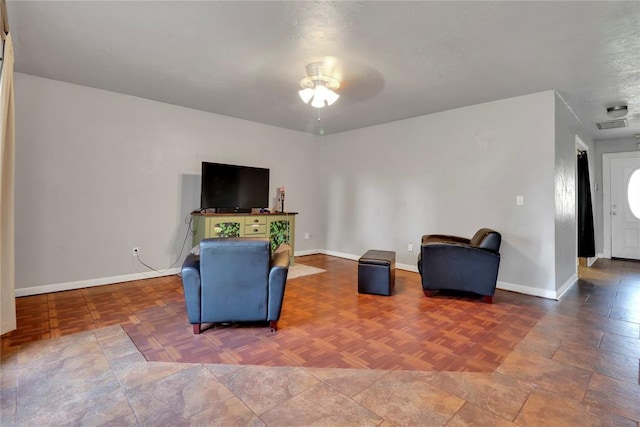 1001 NW 2nd St, Moore, OK 73160 - living area featuring ceiling fan and baseboards