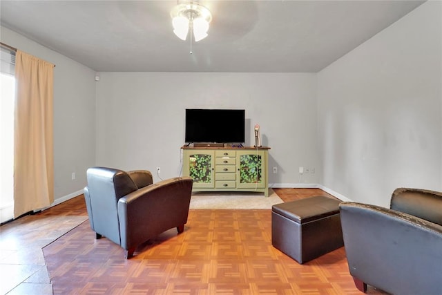 1001 NW 2nd St, Moore, OK 73160 - living area featuring ceiling fan and baseboards