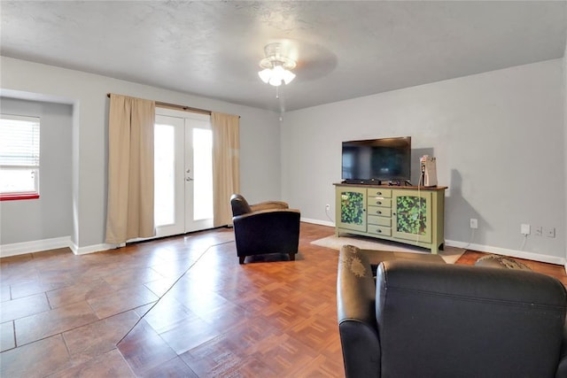 1001 NW 2nd St, Moore, OK 73160 - living room with french doors and a ceiling fan
