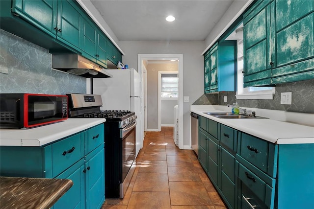 1001 NW 2nd St, Moore, OK 73160 - kitchen with appliances with stainless steel finishes, green cabinetry, backsplash, and recessed lighting