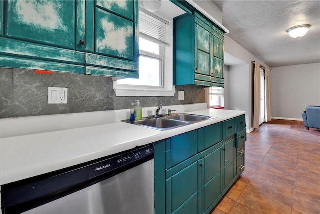 1001 NW 2nd St, Moore, OK 73160 - kitchen with dishwasher, green cabinets, tasteful backsplash, and light countertops