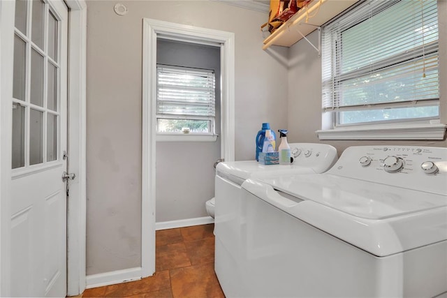 1001 NW 2nd St, Moore, OK 73160 - laundry area with separate washer and dryer, healthy amount of natural light, and tile patterned flooring