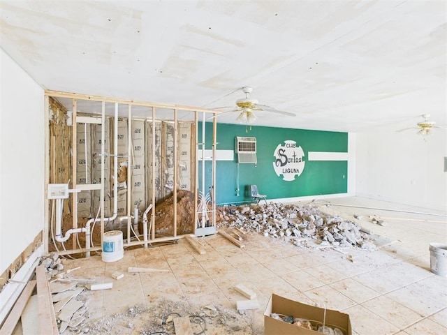 410 S Lowe Ave, Pauls Valley, OK 73075 - spare room featuring ceiling fan and an AC wall unit