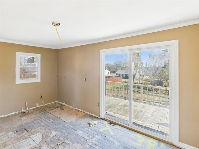 410 S Lowe Ave, Pauls Valley, OK 73075 - doorway to outside featuring ornamental molding