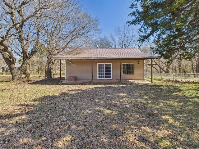 410 S Lowe Ave, Pauls Valley, OK 73075 - rear view of property with a metal roof and a patio