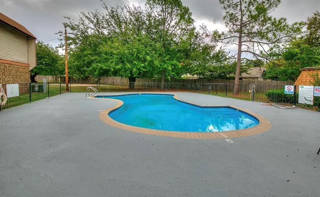 401 SE 12th Ave Unit 206, Norman, OK 73071 - community pool featuring a patio
