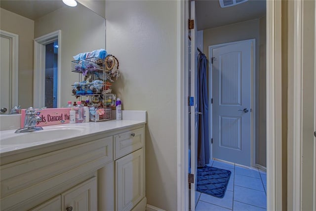 bathroom with vanity and tile patterned floors