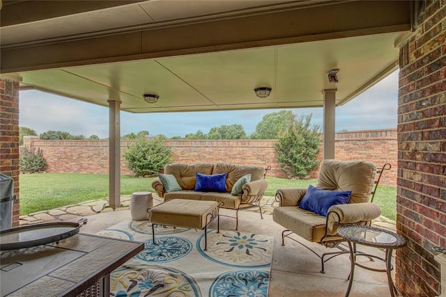 fenced backyard with an outdoor living space and a patio area
