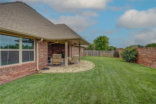 fenced backyard with a patio area