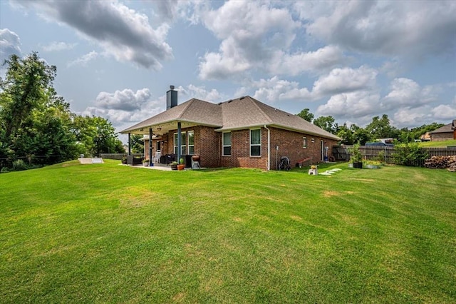 4450 Buffalo Hl, Guthrie, OK 73044 - rear view of house featuring a patio, brick siding, a fenced backyard, and a chimney