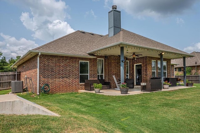 4450 Buffalo Hl, Guthrie, OK 73044 - back of property with brick siding, a patio, an outdoor living space, and a ceiling fan