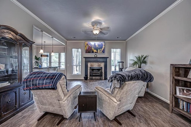 4450 Buffalo Hl, Guthrie, OK 73044 - living room featuring wood finished floors, ceiling fan, crown molding, and a fireplace