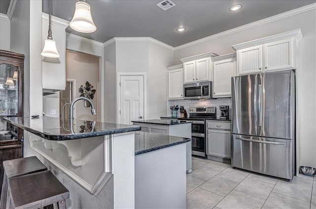 4450 Buffalo Hl, Guthrie, OK 73044 - kitchen featuring stainless steel appliances, a peninsula, dark stone counters, tasteful backsplash, and white cabinets