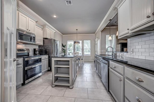 4450 Buffalo Hl, Guthrie, OK 73044 - kitchen featuring stainless steel appliances, open shelves, backsplash, ornamental molding, and pendant lighting