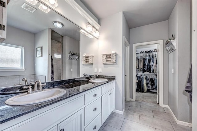 4450 Buffalo Hl, Guthrie, OK 73044 - full bath with double vanity, a spacious closet, tile patterned floors, and a tile shower