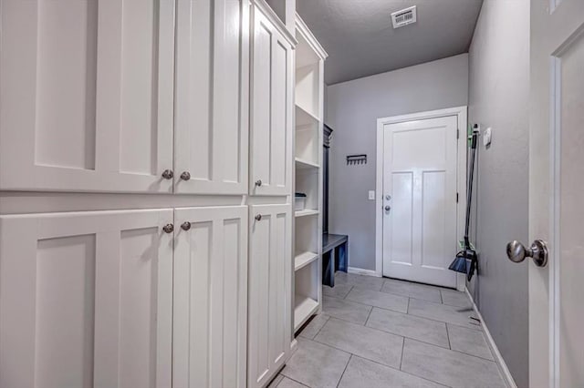 4450 Buffalo Hl, Guthrie, OK 73044 - mudroom with baseboards and light tile patterned flooring
