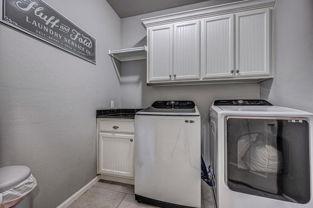 4450 Buffalo Hl, Guthrie, OK 73044 - laundry room with washer and clothes dryer, cabinet space, and light tile patterned floors