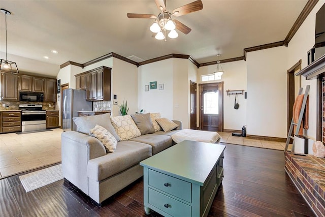 1106 Polk St, Piedmont, OK 73078 - living area with ceiling fan, ornamental molding, recessed lighting, and wood finished floors