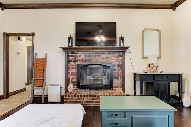 1106 Polk St, Piedmont, OK 73078 - bedroom featuring wood finished floors, ornamental molding, and a brick fireplace