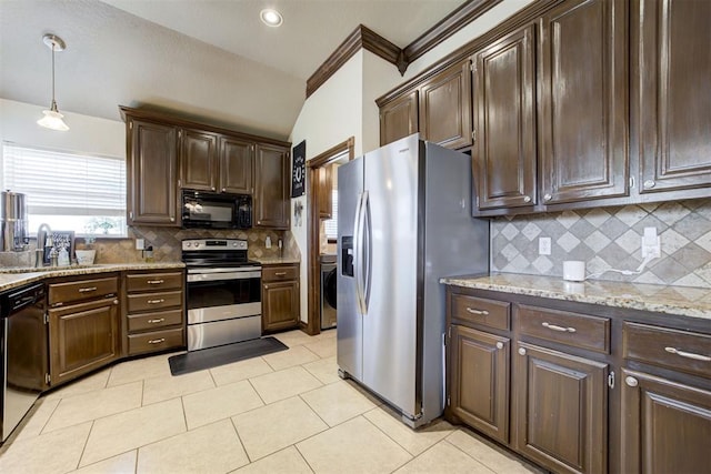 1106 Polk St, Piedmont, OK 73078 - kitchen with appliances with stainless steel finishes, washer / clothes dryer, dark brown cabinets, backsplash, and light stone countertops