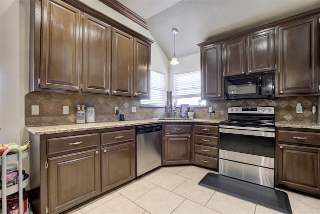 1106 Polk St, Piedmont, OK 73078 - kitchen with appliances with stainless steel finishes, vaulted ceiling, backsplash, light tile patterned floors, and dark brown cabinetry