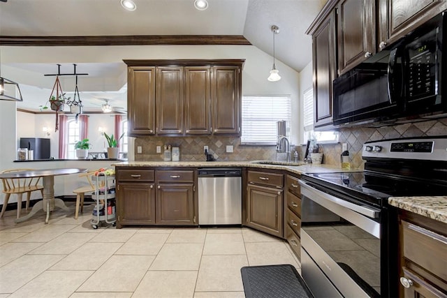 1106 Polk St, Piedmont, OK 73078 - kitchen with stainless steel appliances, tasteful backsplash, dark brown cabinets, light stone countertops, and ornamental molding