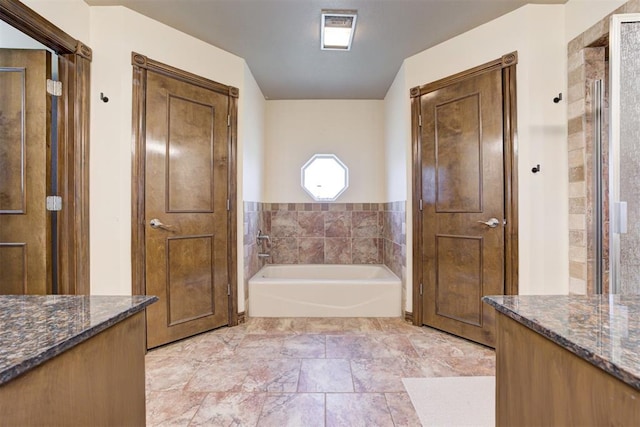 1106 Polk St, Piedmont, OK 73078 - full bathroom featuring a garden tub and vanity