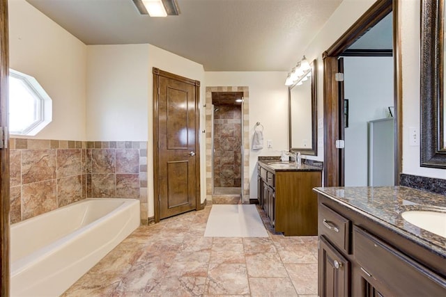 1106 Polk St, Piedmont, OK 73078 - full bathroom with two vanities, a bath, and tiled shower