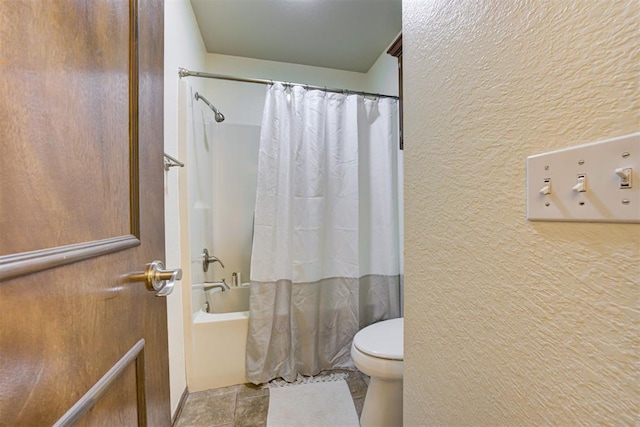 1106 Polk St, Piedmont, OK 73078 - bathroom featuring shower / bath combo, a textured wall, and tile patterned flooring