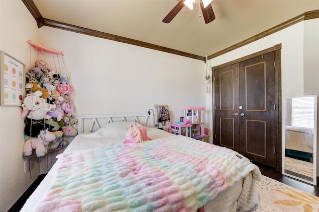 1106 Polk St, Piedmont, OK 73078 - bedroom featuring crown molding, wood finished floors, a closet, and a ceiling fan