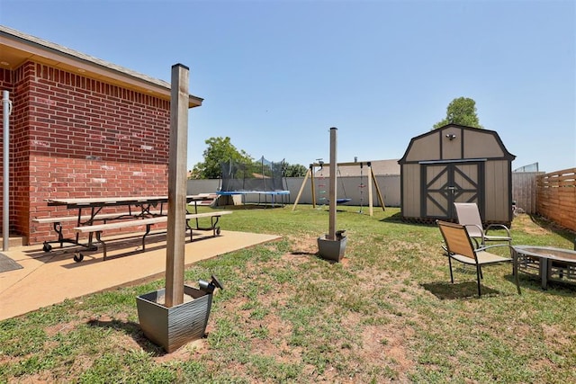 1106 Polk St, Piedmont, OK 73078 - fenced backyard with a trampoline, a storage shed, and a patio area