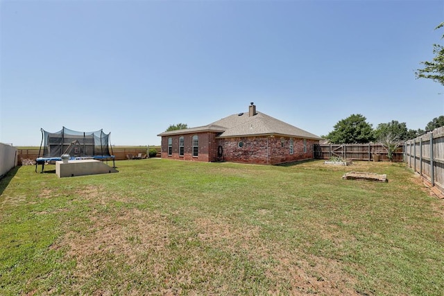 1106 Polk St, Piedmont, OK 73078 - fenced backyard featuring a trampoline