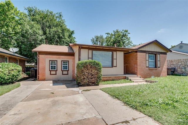 1417 Downing St, The Village, OK 73120 - view of front of home with brick siding