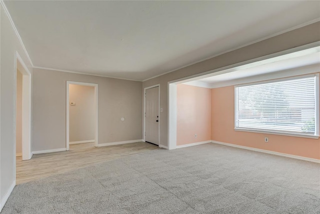 1417 Downing St, The Village, OK 73120 - spare room with light carpet and ornamental molding