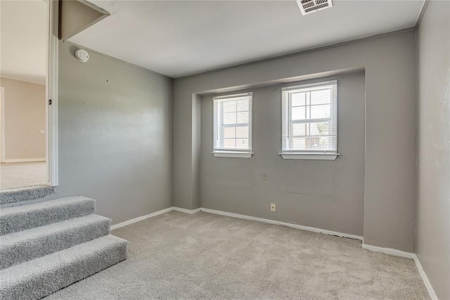 1417 Downing St, The Village, OK 73120 - spare room featuring carpet and stairway