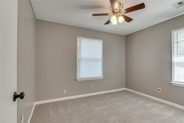 1417 Downing St, The Village, OK 73120 - unfurnished room with healthy amount of natural light, ceiling fan, and carpet flooring