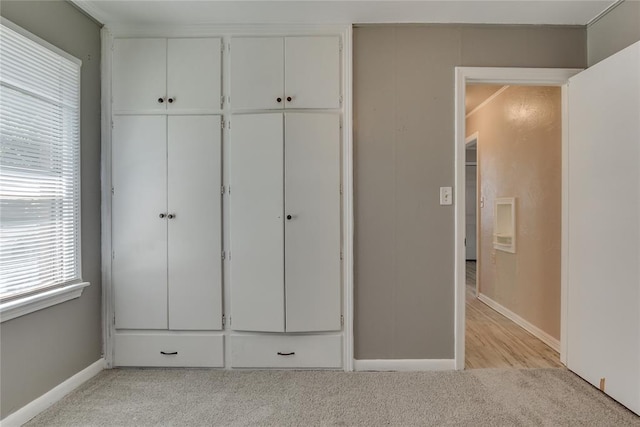 1417 Downing St, The Village, OK 73120 - unfurnished bedroom featuring light carpet and a closet