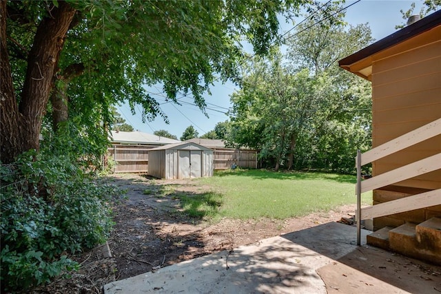 1417 Downing St, The Village, OK 73120 - fenced backyard featuring a storage shed and a patio area