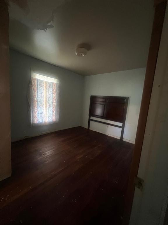 1139 E 2nd St, Cushing, OK 74023 - unfurnished room featuring hardwood / wood-style floors