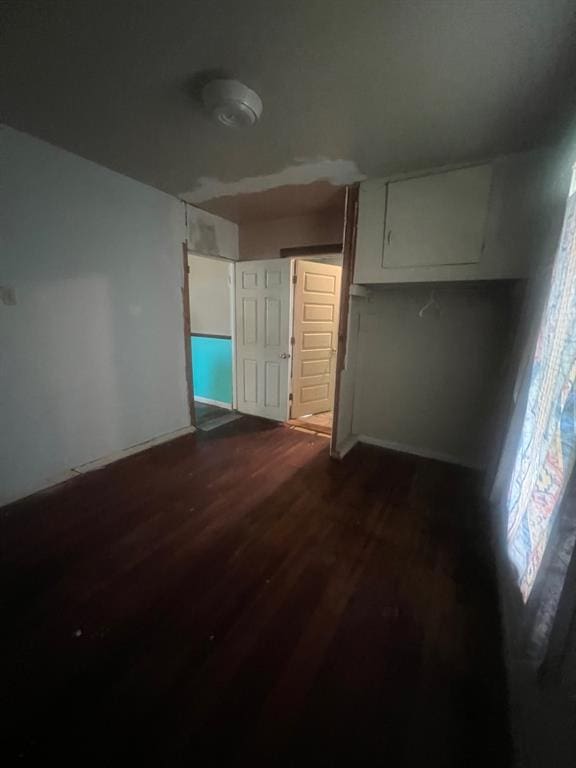 1139 E 2nd St, Cushing, OK 74023 - spare room featuring dark wood-style floors