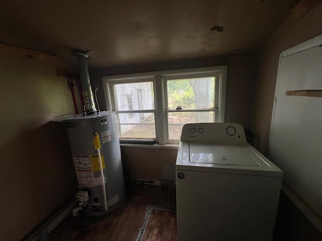 1139 E 2nd St, Cushing, OK 74023 - laundry area with washer / dryer, gas water heater, and dark wood-style flooring