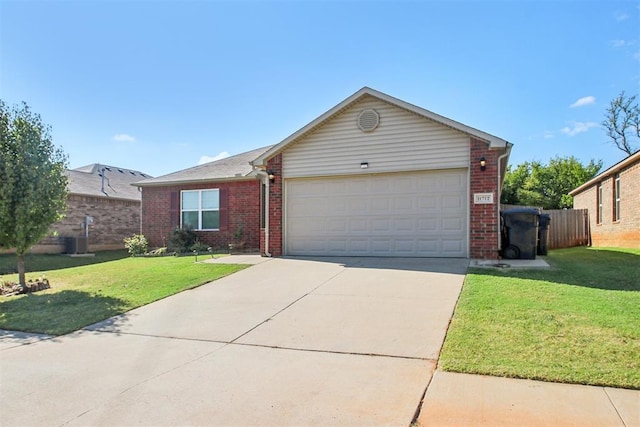 11712 NW 130th St, Piedmont, OK 73078 - ranch-style house featuring concrete driveway, an attached garage, and brick siding