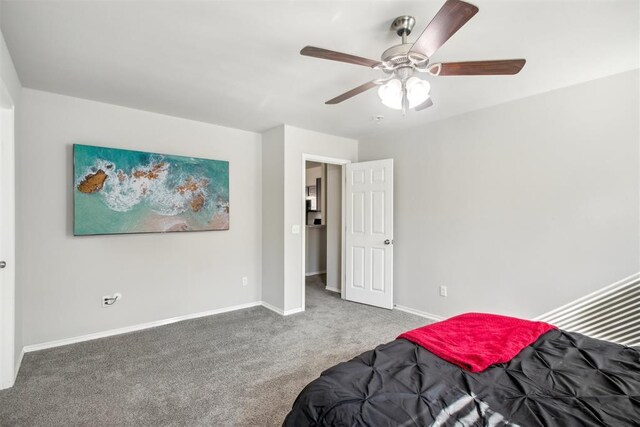11712 NW 130th St, Piedmont, OK 73078 - carpeted bedroom featuring baseboards and a ceiling fan