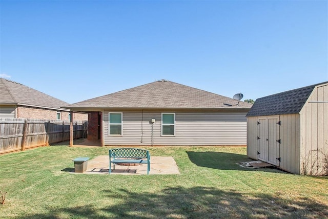 11712 NW 130th St, Piedmont, OK 73078 - back of house with a storage shed, a patio area, a fenced backyard, and a shingled roof