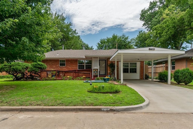1726 Caddell Ln, Norman, OK 73069 - ranch-style home featuring brick siding, driveway, and a carport