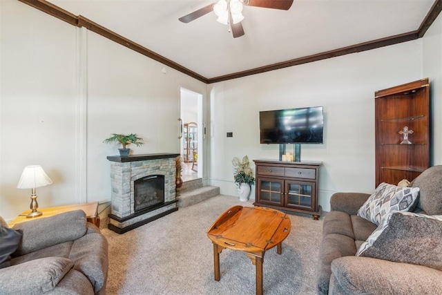 1726 Caddell Ln, Norman, OK 73069 - carpeted living area with a ceiling fan, ornamental molding, and a stone fireplace