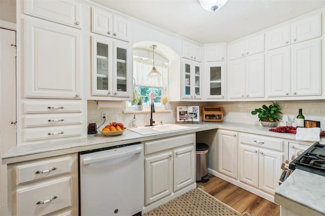 1726 Caddell Ln, Norman, OK 73069 - kitchen with white dishwasher, tasteful backsplash, glass insert cabinets, and white cabinetry